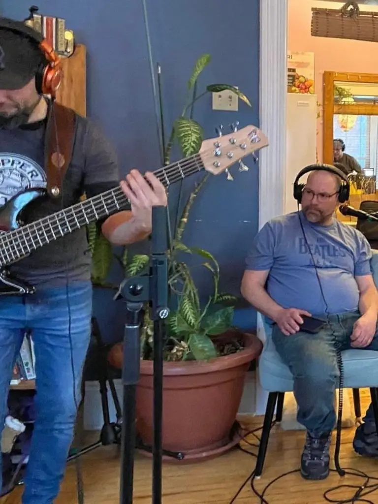 Two musicians in a home recording session.